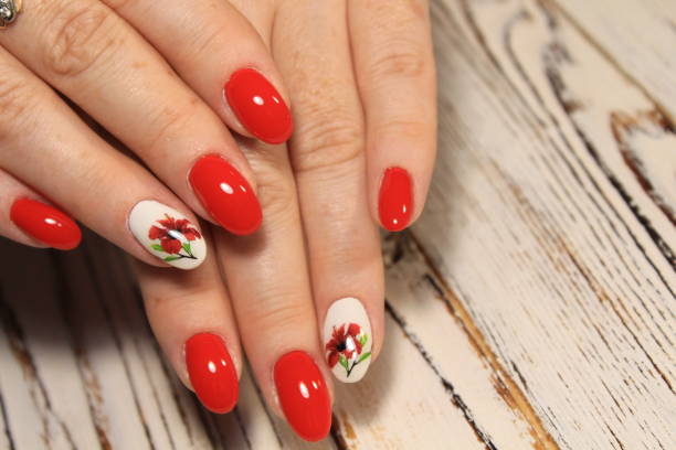 istock Manicured nails colored with red nail polish 1028766794