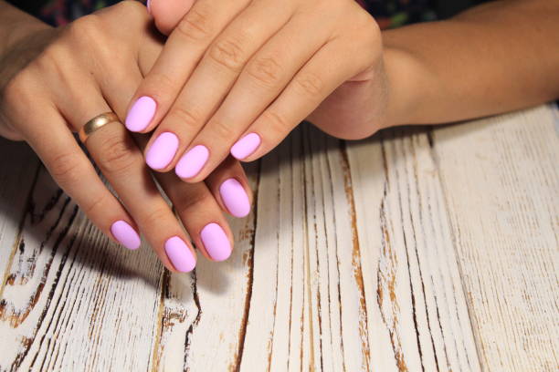 istock glamorous beautiful manicure on a trendy texture background 1028771686