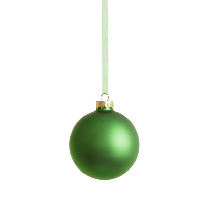 Hanging green christmas bauble isolated on white background.