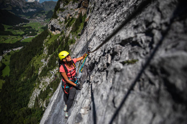 istock Pretty, female climber on a via ferrata 1028773046
