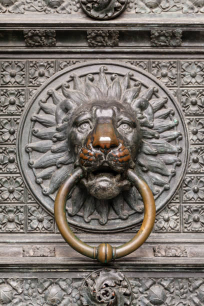 The Gothic Cathedral bronze lion head door knocker in Cologne, Germany