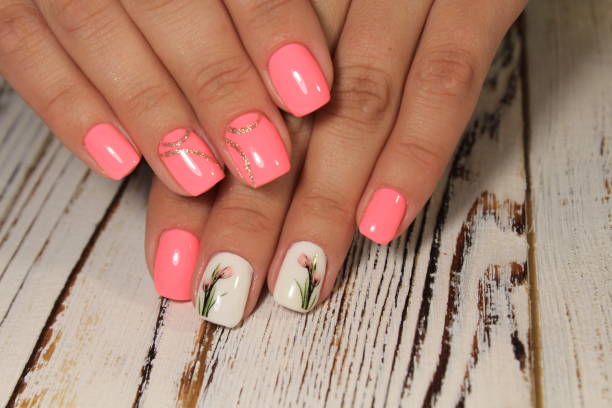 istock Sexual pink manicure on beautiful female hands 1028775994