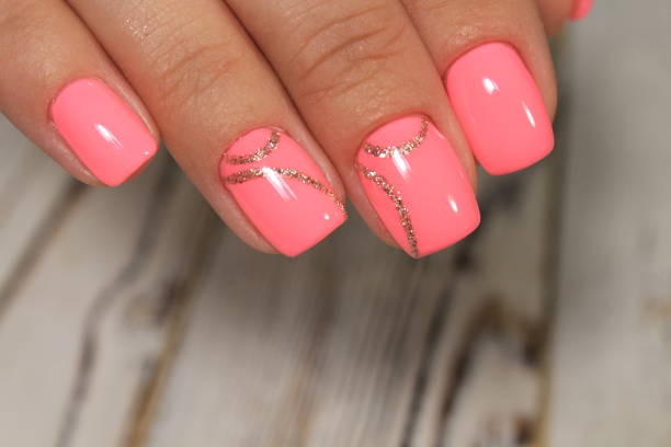 istock Sexual pink manicure on beautiful female hands 1028776324