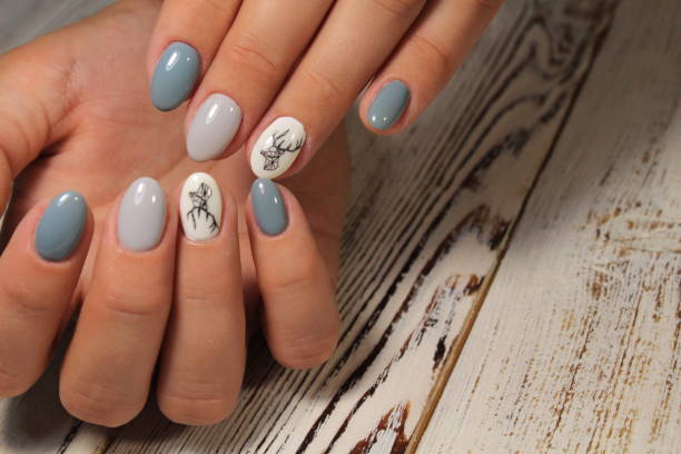 istock Stylish manicure nails color black and silver 1028776506