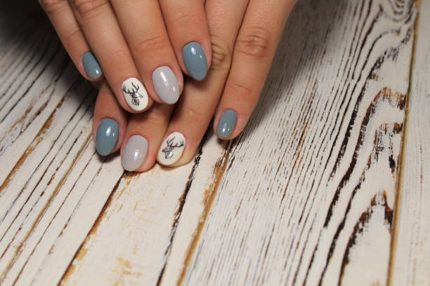 istock glamorous beautiful manicure on a trendy texture background 1028776548
