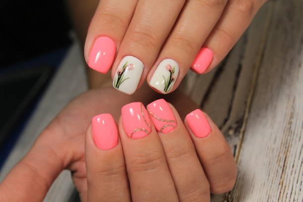 istock Sexual pink manicure on beautiful female hands 1028779248