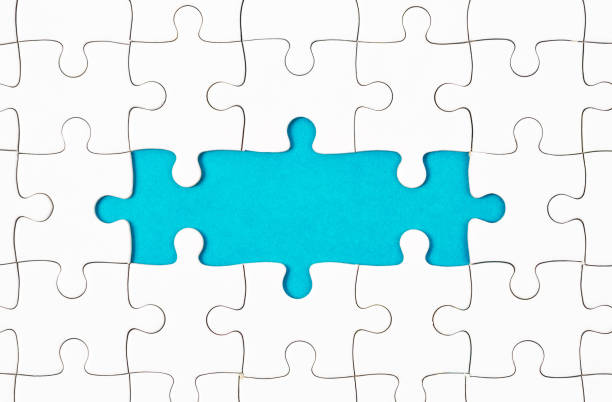 istock Fragment of a folded white jigsaw puzzle 1028780416