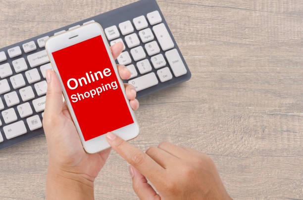 istock Hand holding online shopping on smartphone 1028780504