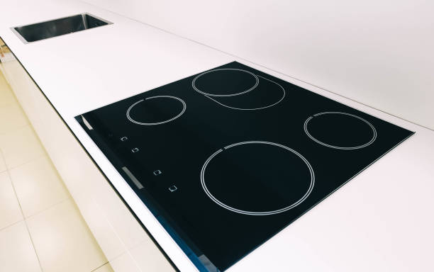 istock induction modern stove, hob in the kitchen. 1028780528
