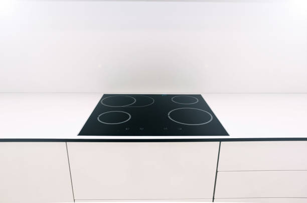 istock induction modern stove, hob in the kitchen. 1028780550