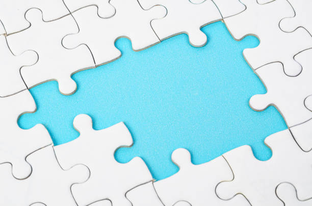 Fragment of a folded white jigsaw puzzle