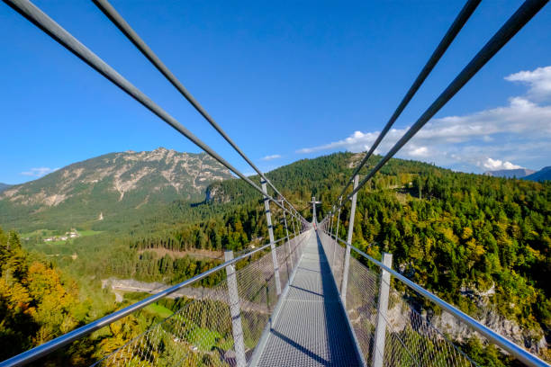 The Geierlay is a suspension bridge in the low mountain range of the Hunsrück in western Germany. It was opened in 2015. It has a span range of 360 metres and is up to 100 metres above ground. On both sides of the bridge are the villages of Mörsdorf and Sosberg.