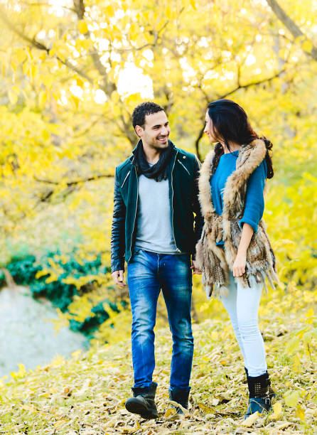 istock Loving Couple in a Park During Fall Season 1028793940