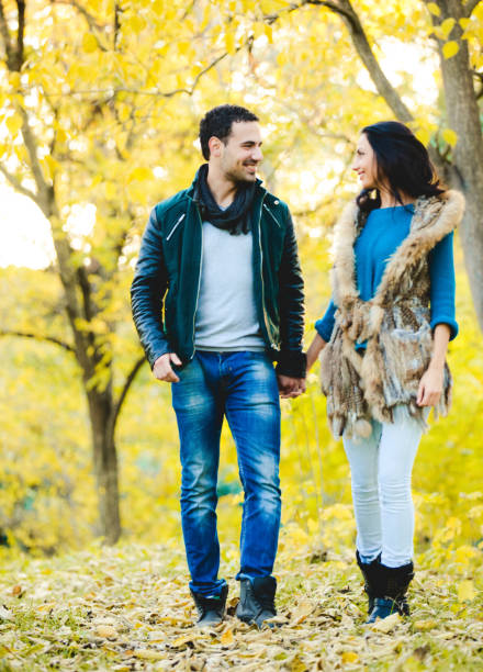 istock Loving Couple in a Park During Fall Season 1028793944