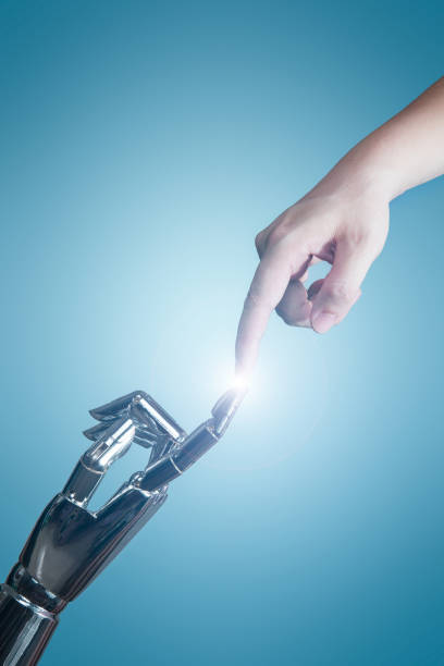 Artificial intelligence Human hand touching with robot technology creation stock pictures, royalty-free photos & images