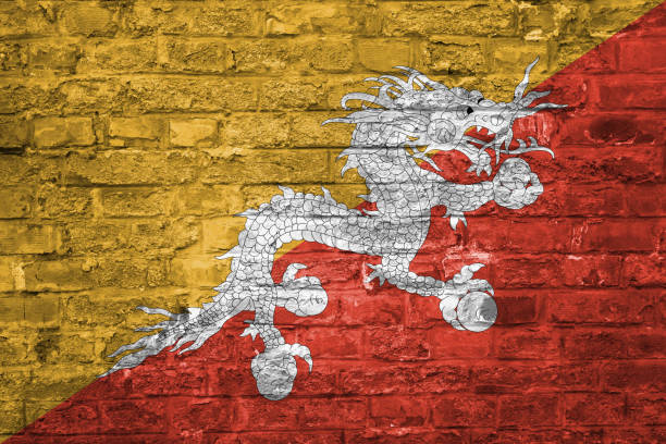 istock Flag of Bhutan over an old brick wall background, surface 1028821746