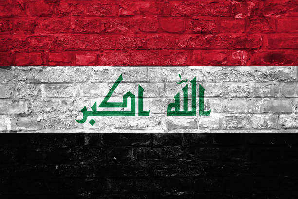 istock Flag of Iraq over an old brick wall background, surface 1028822002