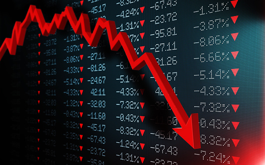 Stock exchange market is falling. Red arrow graph is showing a fall on a black trading board. Selective focus. Horizontal composition with copy space.