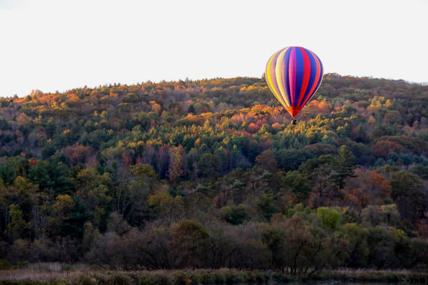 istock hot air ballon over a mountain 1028827392