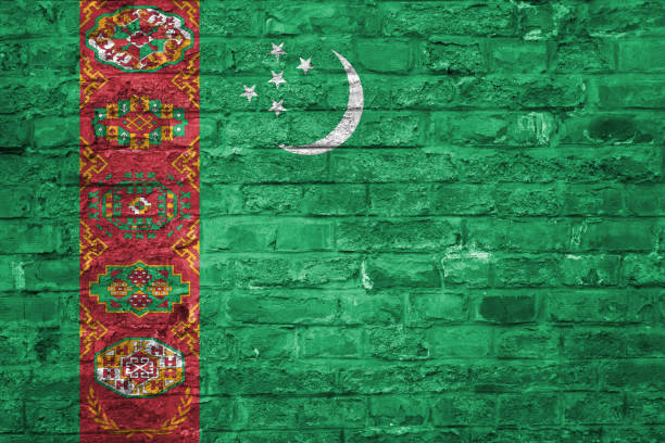 istock Flag of Turkmenistan over an old brick wall background, surface 1028830044