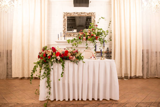 istock table decor for wedding ceremony, table setting, flowers, red and white decor. table for the newlyweds 1028830318