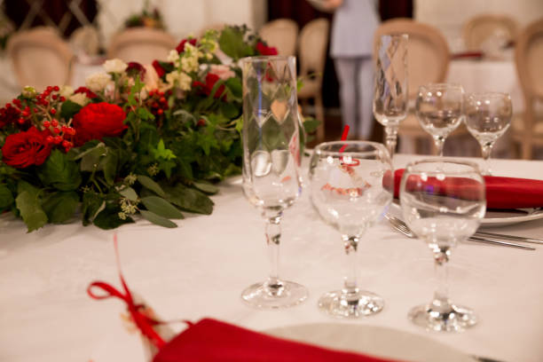 istock close up table decor for wedding ceremony, table setting, flowers, red and white decor 1028830350