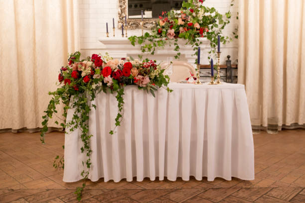istock table decor for wedding ceremony, table setting, flowers, red and white decor. table for the newlyweds 1028830360