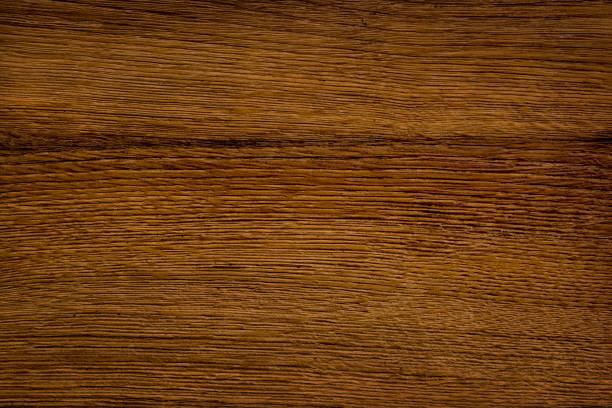 Fine natural texture of lacquered wood board. A wood grain pattern featuring even grains of wood running horizontally across the image. The panel is new, clean and without damages.