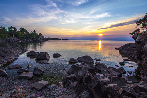 Dusk falls on the rugged shore of Lake Superior in Copper Harbor, Michigan. Copper Harbor is the northernmost point in the state of Michigan.