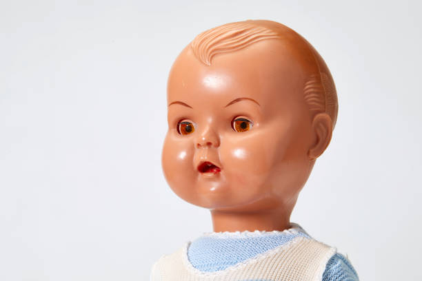 istock Vintage boy doll head close up on white background 1028853436