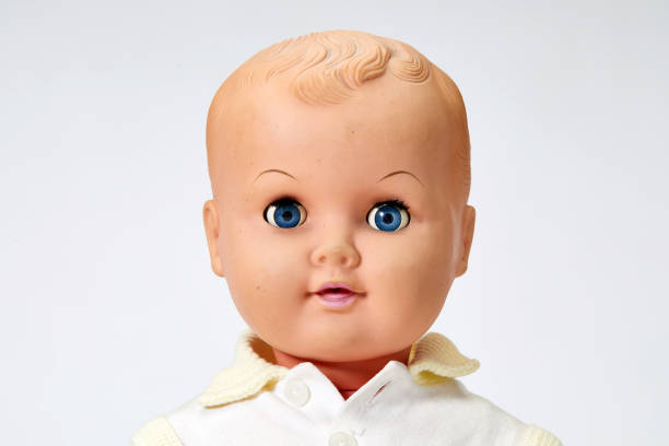 istock Vintage boy doll head close up on white background 1028853504