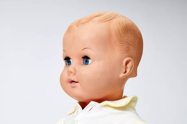istock Vintage boy doll head close up on white background 1028853652