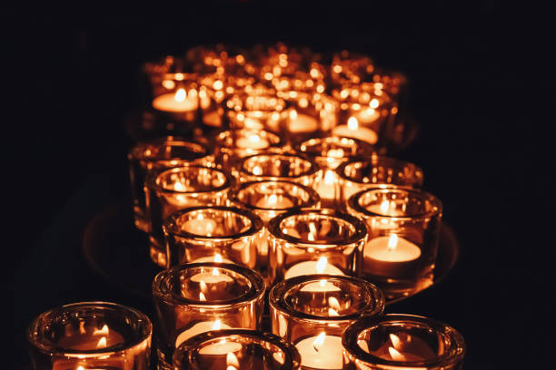 istock Romantic atmosphere, many small, lit candles on the table. Dark background 1028853922