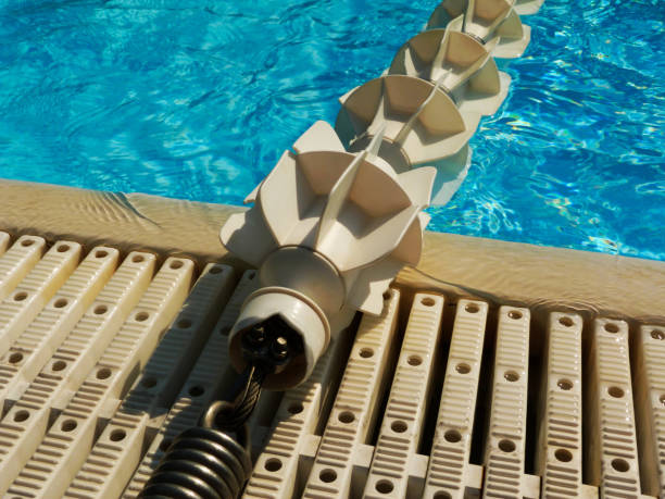 istock open swimming pool with blue water and plastic lane divider 1028857060