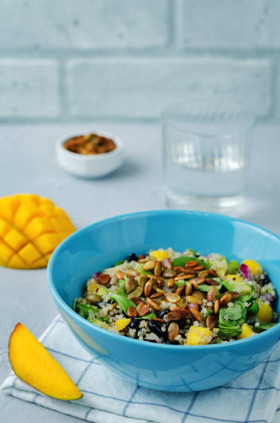 istock Mango black bean arugula pumpkin seed quinoa salad 1028872392
