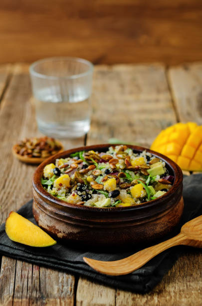 istock Mango black bean arugula pumpkin seed quinoa salad 1028872398
