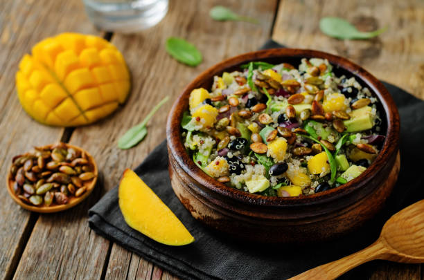 istock Mango black bean arugula pumpkin seed quinoa salad 1028872406