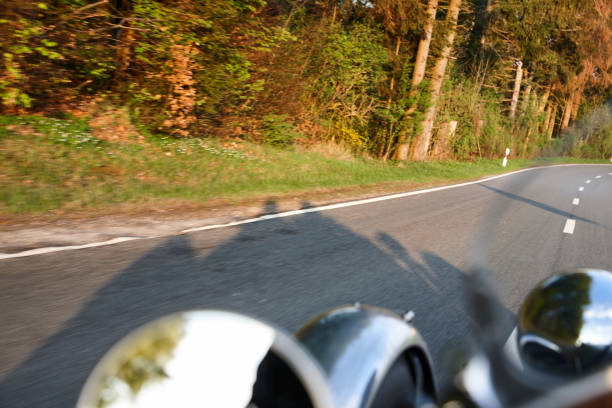 istock People citing in an old car on the road 1028879180