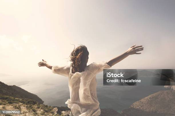 Woman Taking A Breath In Front Of A Spectacular View Stock Photo - Download Image Now