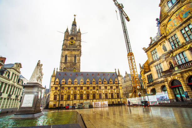 Street view of Sint Baafsplein square with Belfry of Ghent in the historic city center of Ghent (Gent) stock photo