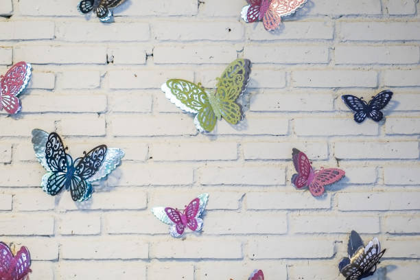 Butterfly toys abundant. Decorated on white walls.