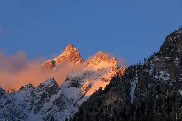 istock Snow Capped Tetons in Fall at Sunrise 1028888550