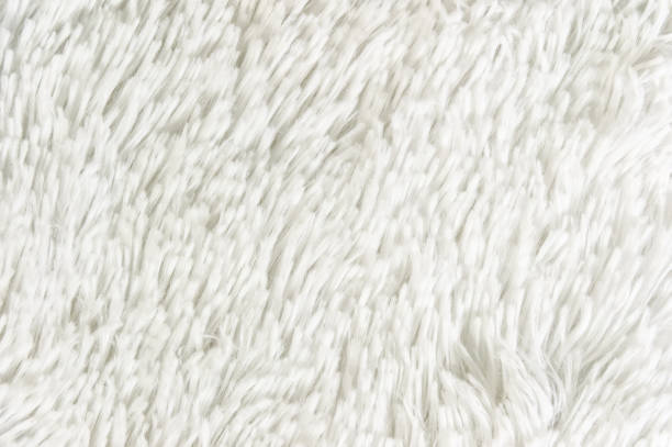 istock Fluffy plaid of polyester with a long heap gray. Comfortable home textiles. Background, texture 1028894066
