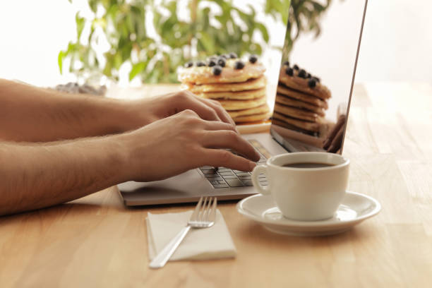 istock Young male hands working on laptop at home 1028904592