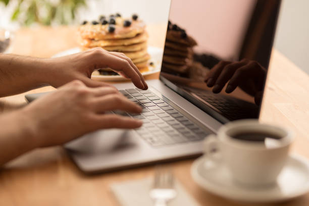 istock Young male hands working on laptop at home 1028906138