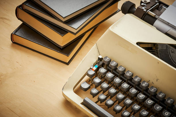 istock bright old typewriter with gray keys and books 1028909982