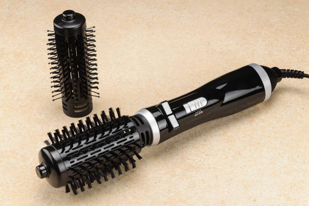 istock Black brush hair dryer on the marble background with accessory 1028910006