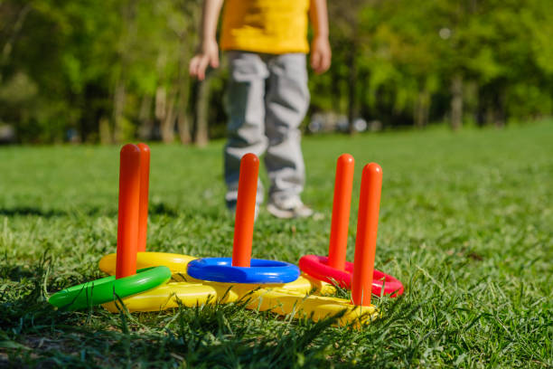 istock Ring throw summer game on a green lawn in the sun 1028914146
