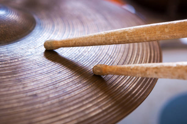 istock Pair of drumsticks lying on cymbal. 1028931322