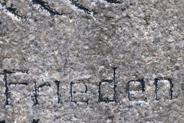 istock frieden -german word for peace in a tombstone in berlin 1028939708